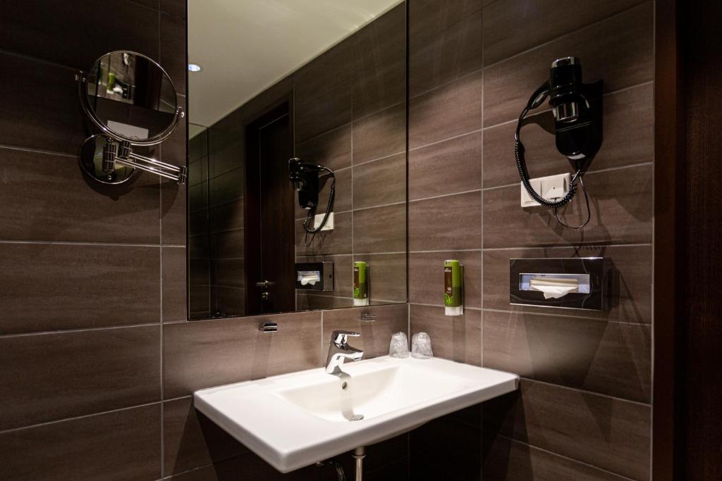 Koupelna v ubytování Tobbaccon Hotel