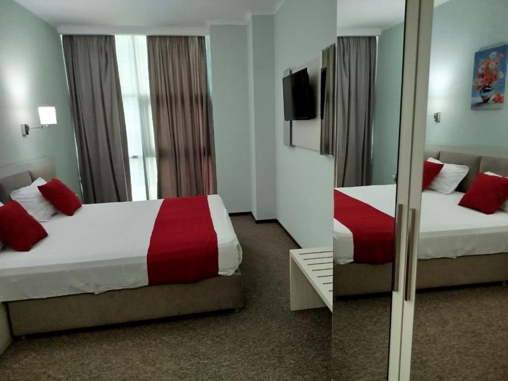 Postel nebo postele na pokoji v ubytování Green Tower Hotel