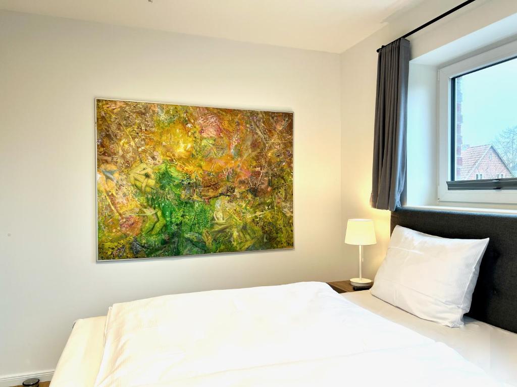 Postel nebo postele na pokoji v ubytování Apartmenthaus Emily by POLY Hohwacht