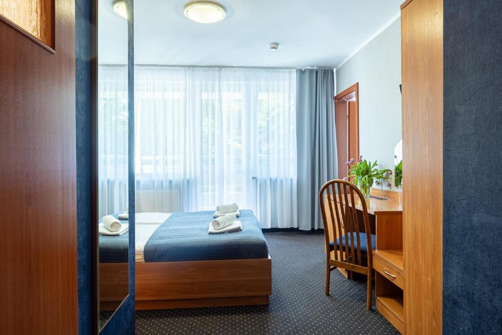 Łóżko lub łóżka w pokoju w obiekcie Baltic Inn