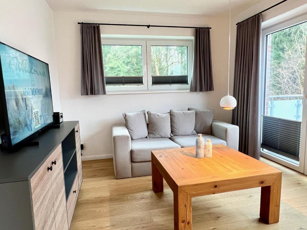 TV a/nebo společenská místnost v ubytování Apartmenthaus Emily by POLY Hohwacht