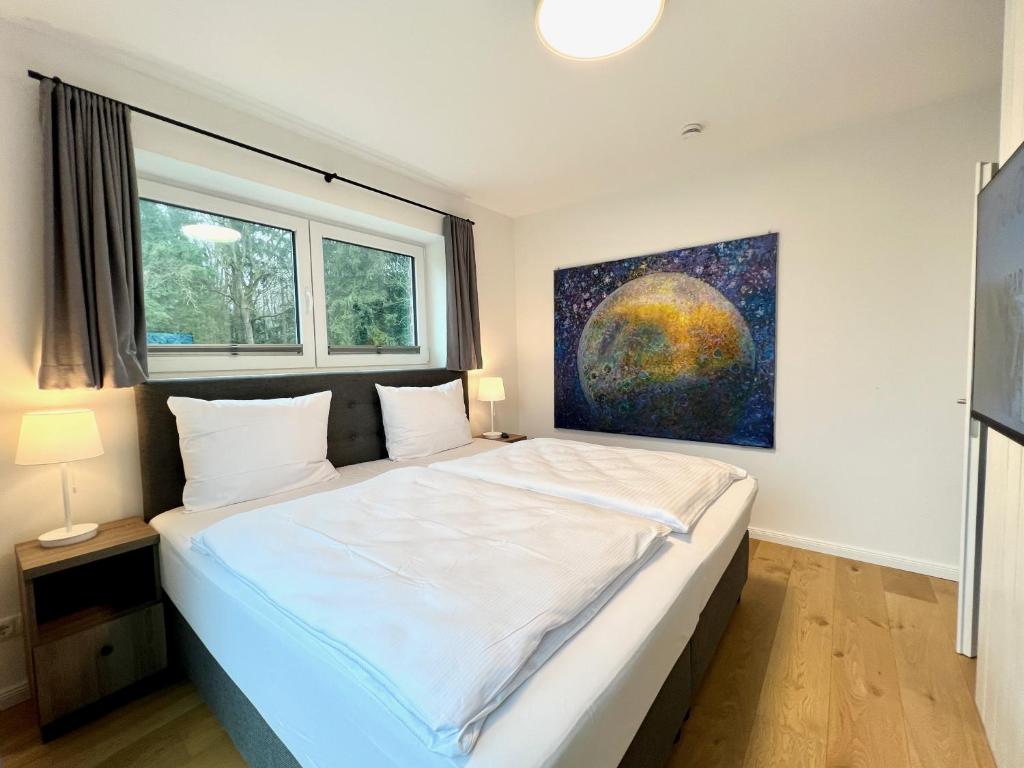Postel nebo postele na pokoji v ubytování Apartmenthaus Emily by POLY Hohwacht