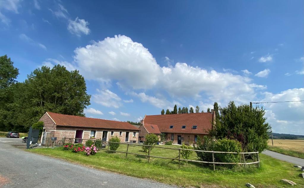 a house on the side of a road at la ferme au bois dormant in Wemaers-Cappel