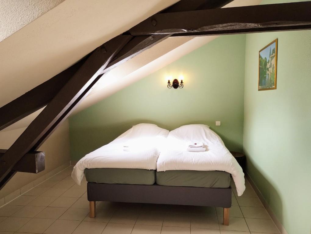 Postel nebo postele na pokoji v ubytování Hotel Rêve de la Vallée