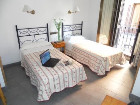 Postel nebo postele na pokoji v ubytování Hostal Ivor