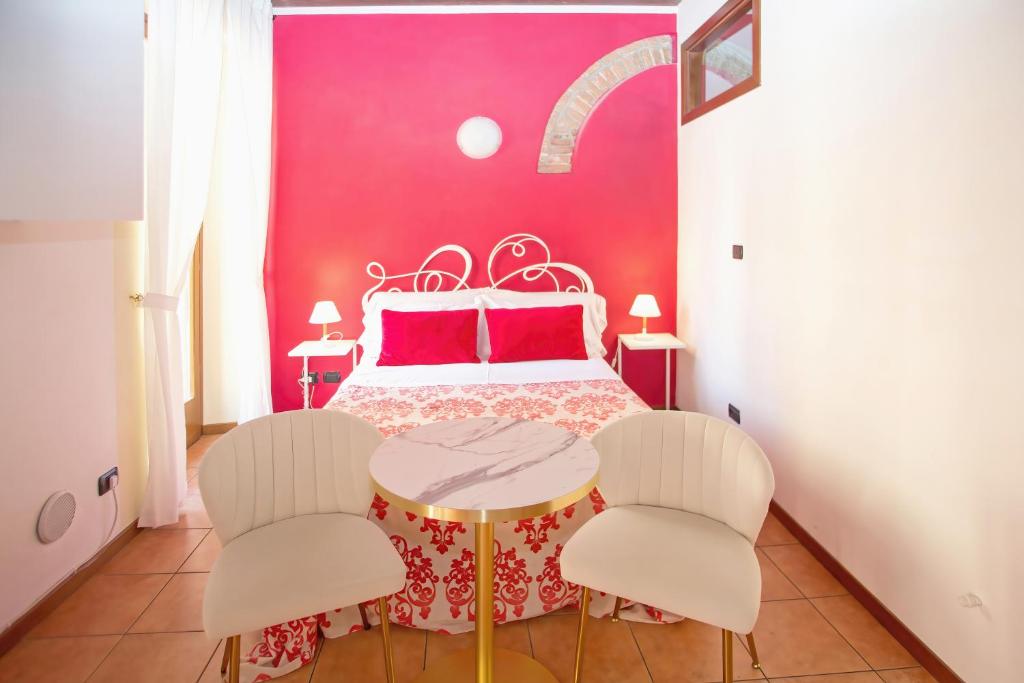 Postel nebo postele na pokoji v ubytování Veronetta House