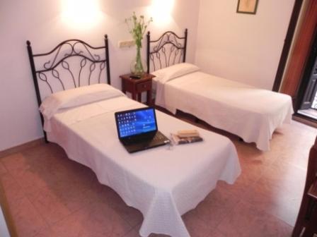 Postel nebo postele na pokoji v ubytování Hostal Ivor