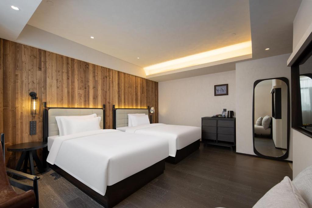 Postel nebo postele na pokoji v ubytování Presidential Palace YiLi Hotel Nanjing