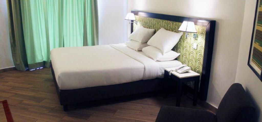 Lova arba lovos apgyvendinimo įstaigoje Le Grand Hotel d'Abidjan