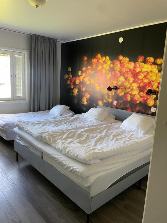 Postel nebo postele na pokoji v ubytování Hotell Smedjan