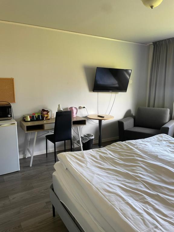 Postel nebo postele na pokoji v ubytování Hotell Smedjan