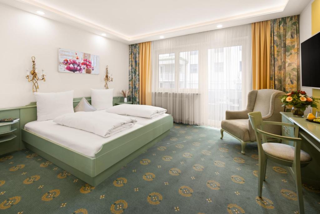 Postel nebo postele na pokoji v ubytování Hotel Dreiflüssehof