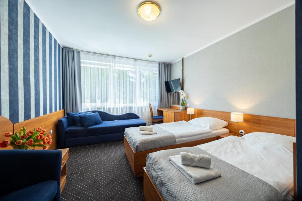 Łóżko lub łóżka w pokoju w obiekcie Baltic Inn