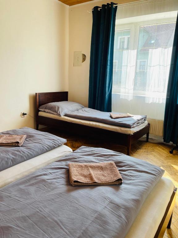 Postel nebo postele na pokoji v ubytování Penzion Trojna Lednice-vhodné na svatby,rodinné akce,teambuilding