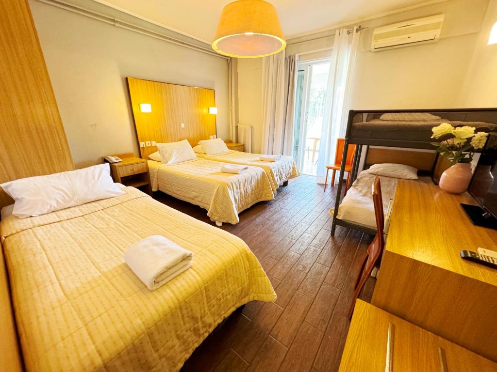 Postel nebo postele na pokoji v ubytování Myrto Hotel