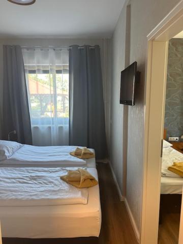Postel nebo postele na pokoji v ubytování Hotel Pirol