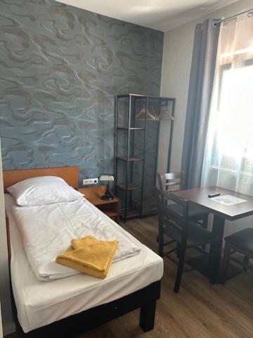Postel nebo postele na pokoji v ubytování Hotel Pirol