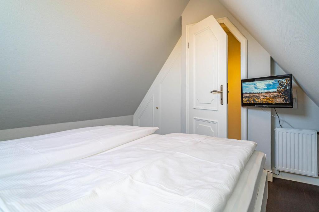Postel nebo postele na pokoji v ubytování Haus Strandoase