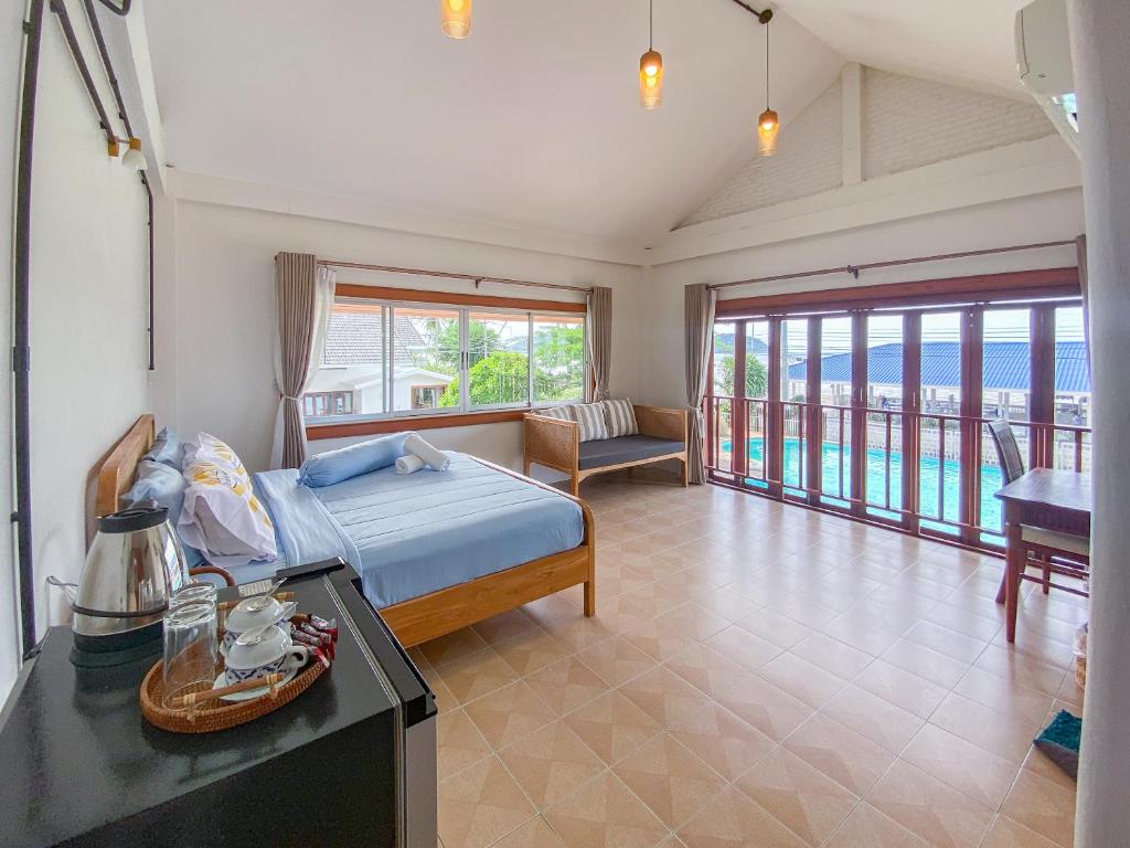 Postel nebo postele na pokoji v ubytování Bangsaphan Resort