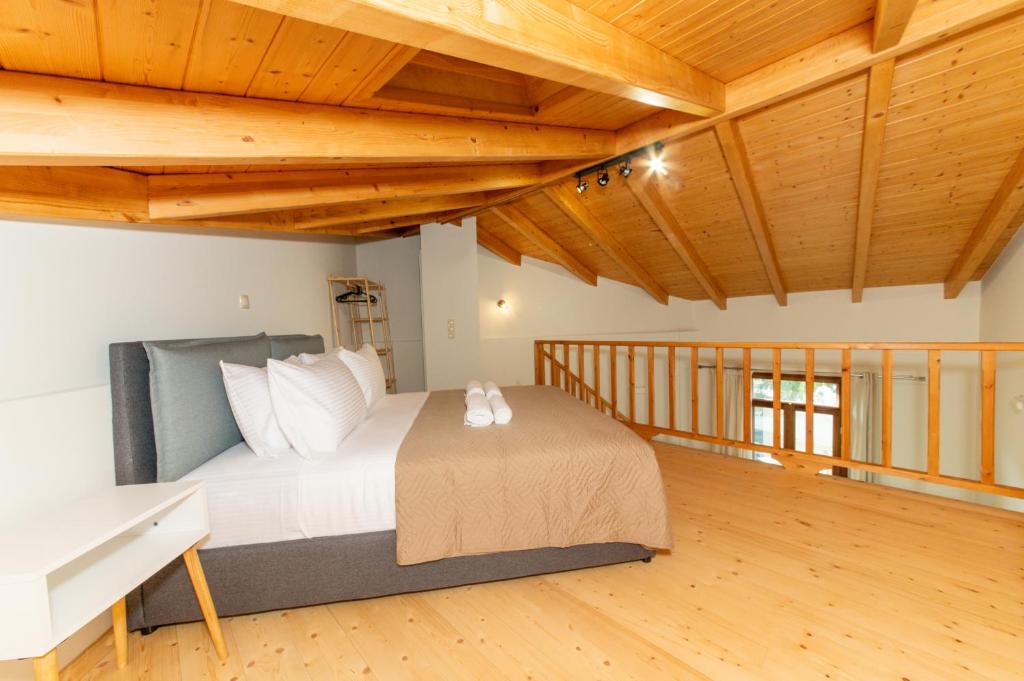 Postel nebo postele na pokoji v ubytování Mirabilis Suites