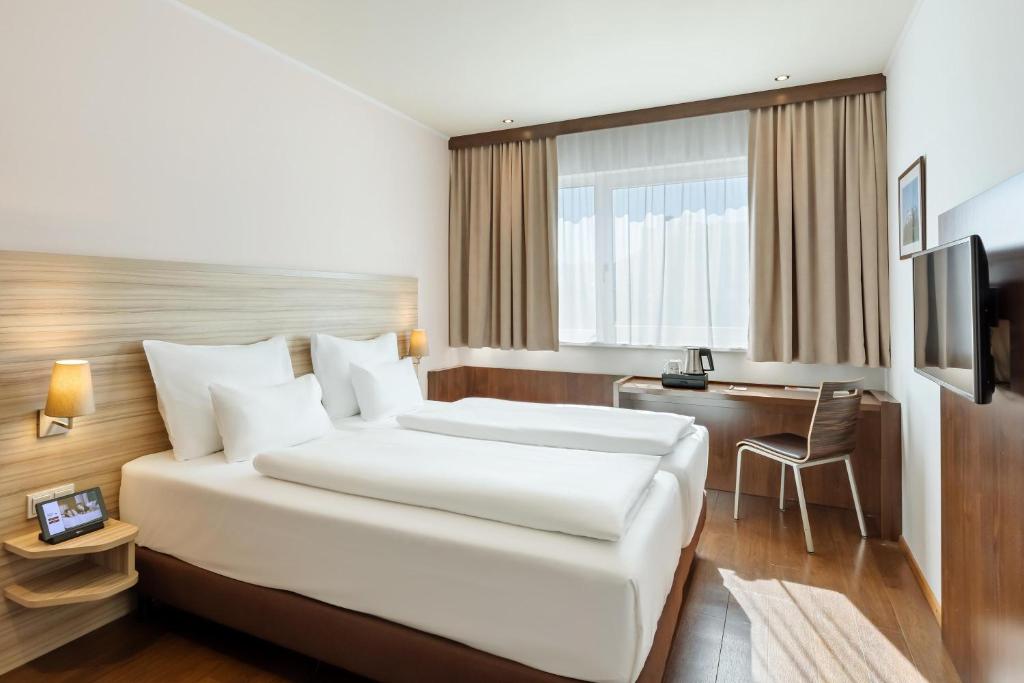 Postel nebo postele na pokoji v ubytování Austria Trend Hotel Salzburg Messe