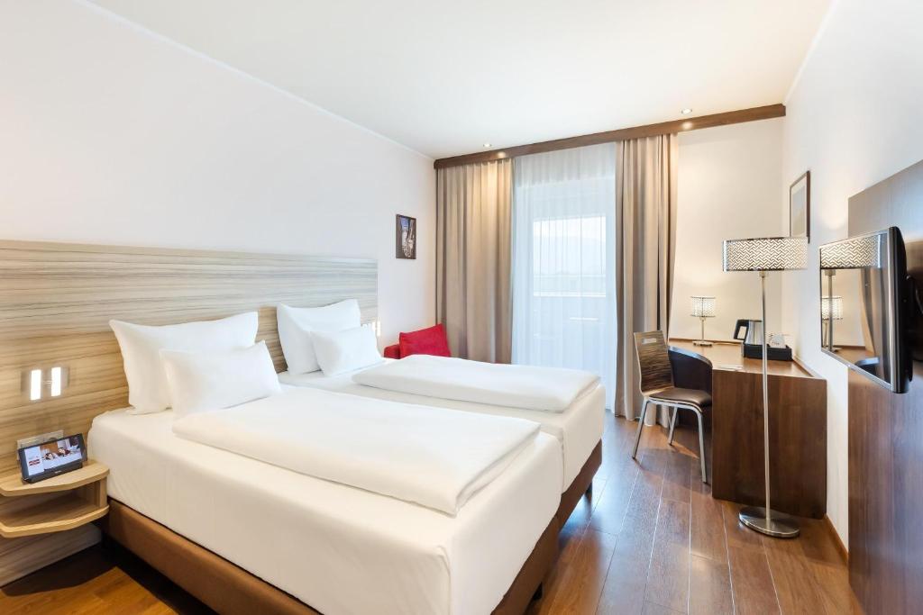 Postel nebo postele na pokoji v ubytování Austria Trend Hotel Salzburg Messe