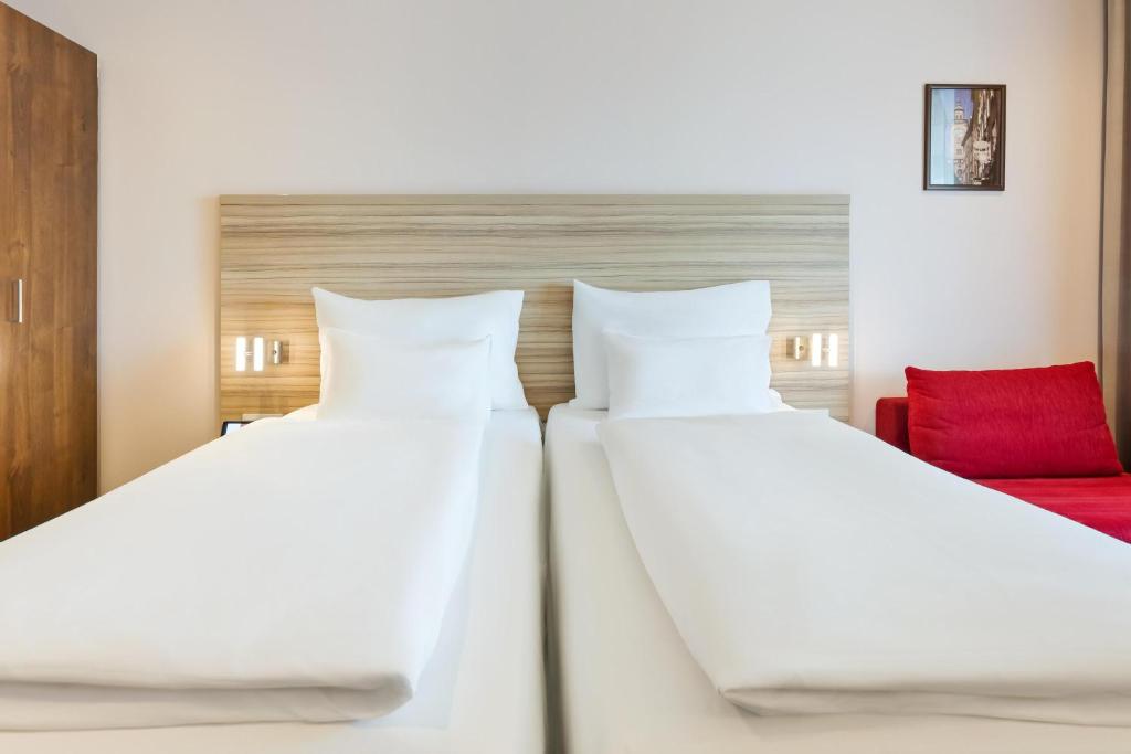 Postel nebo postele na pokoji v ubytování Austria Trend Hotel Salzburg Messe