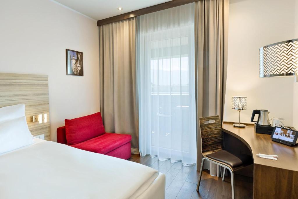 Postel nebo postele na pokoji v ubytování Austria Trend Hotel Salzburg Messe