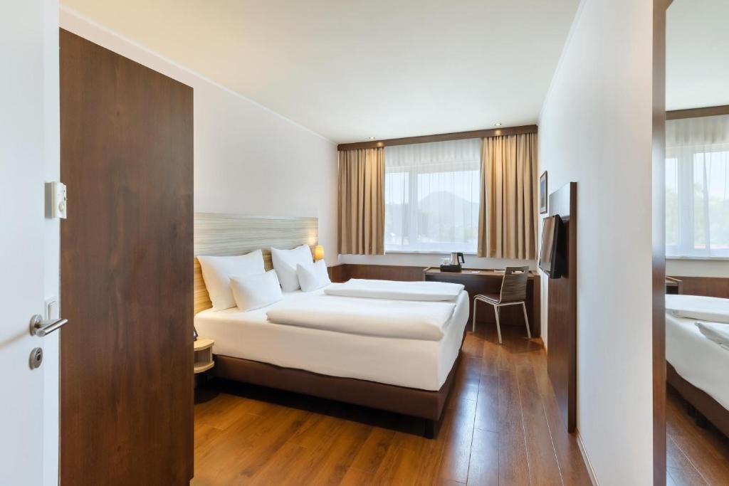 Postel nebo postele na pokoji v ubytování Austria Trend Hotel Salzburg Messe