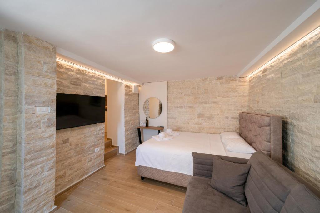 Postel nebo postele na pokoji v ubytování Christian Studio Apartments