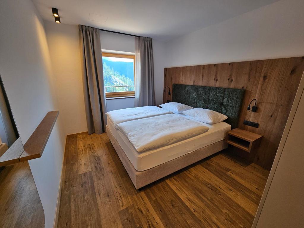 Postel nebo postele na pokoji v ubytování Apartments Kranebitt