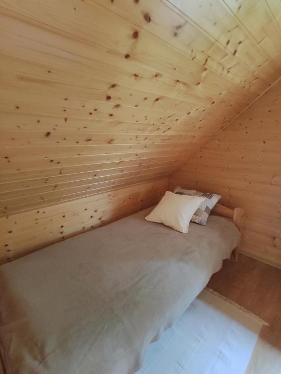 Posteľ alebo postele v izbe v ubytovaní Domek letniskowy Arkady