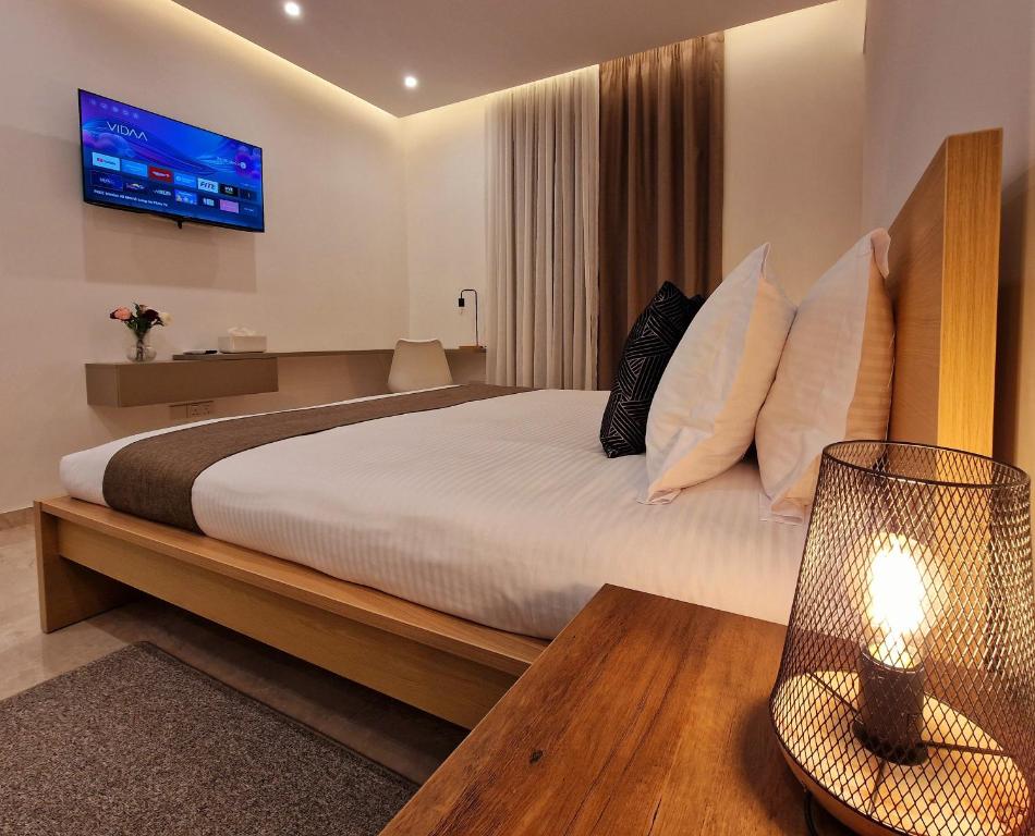 Postel nebo postele na pokoji v ubytování Sveltos Residence Suites