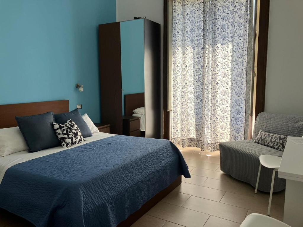 Postel nebo postele na pokoji v ubytování Jonio B&B
