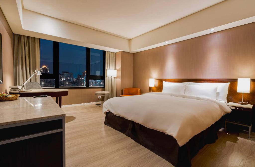 Postel nebo postele na pokoji v ubytování 家美瑞品 台北 - Jiamei Hotel