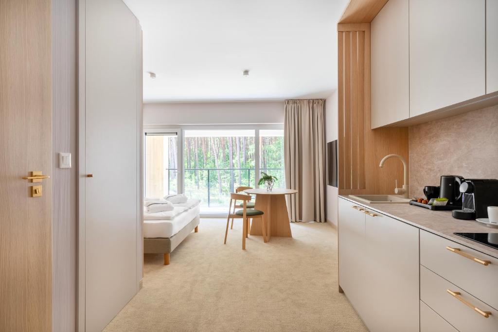 Kuchyň nebo kuchyňský kout v ubytování Sea Shell Apartments Łukęcin