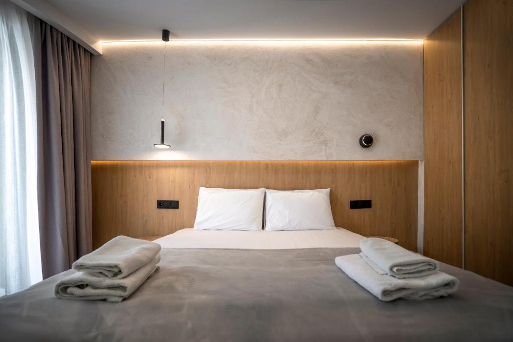 Posteľ alebo postele v izbe v ubytovaní Dionisos Resort