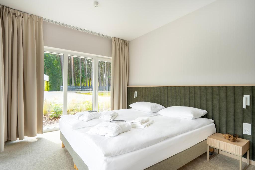 Postel nebo postele na pokoji v ubytování Sea Shell Apartments Łukęcin