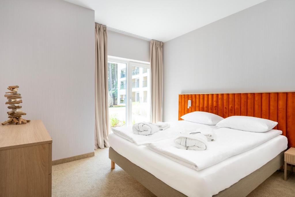 Postel nebo postele na pokoji v ubytování Sea Shell Apartments Łukęcin