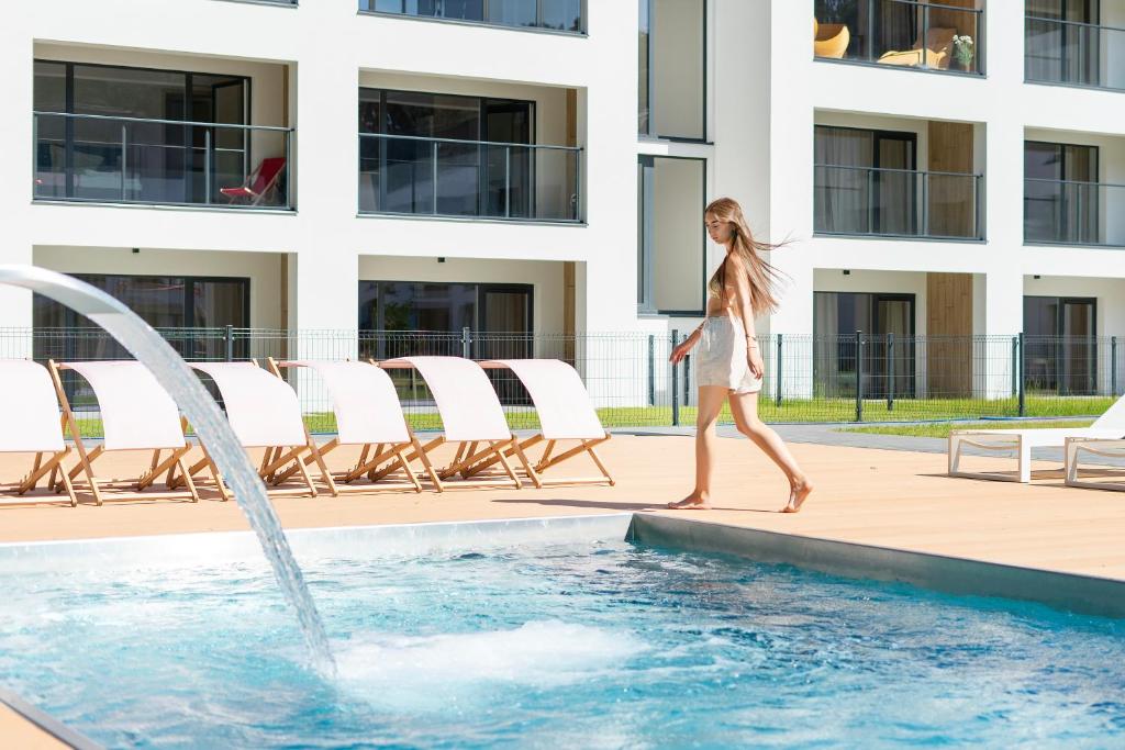 Bazén v ubytování Sea Shell Apartments Łukęcin nebo v jeho okolí