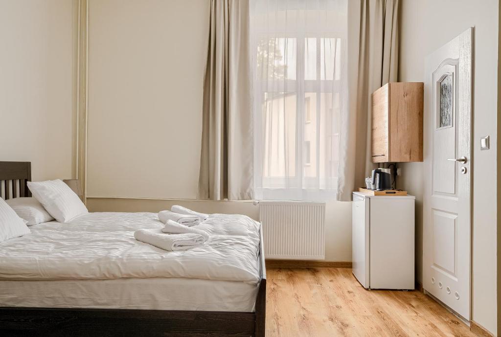 Postel nebo postele na pokoji v ubytování Willa Ster