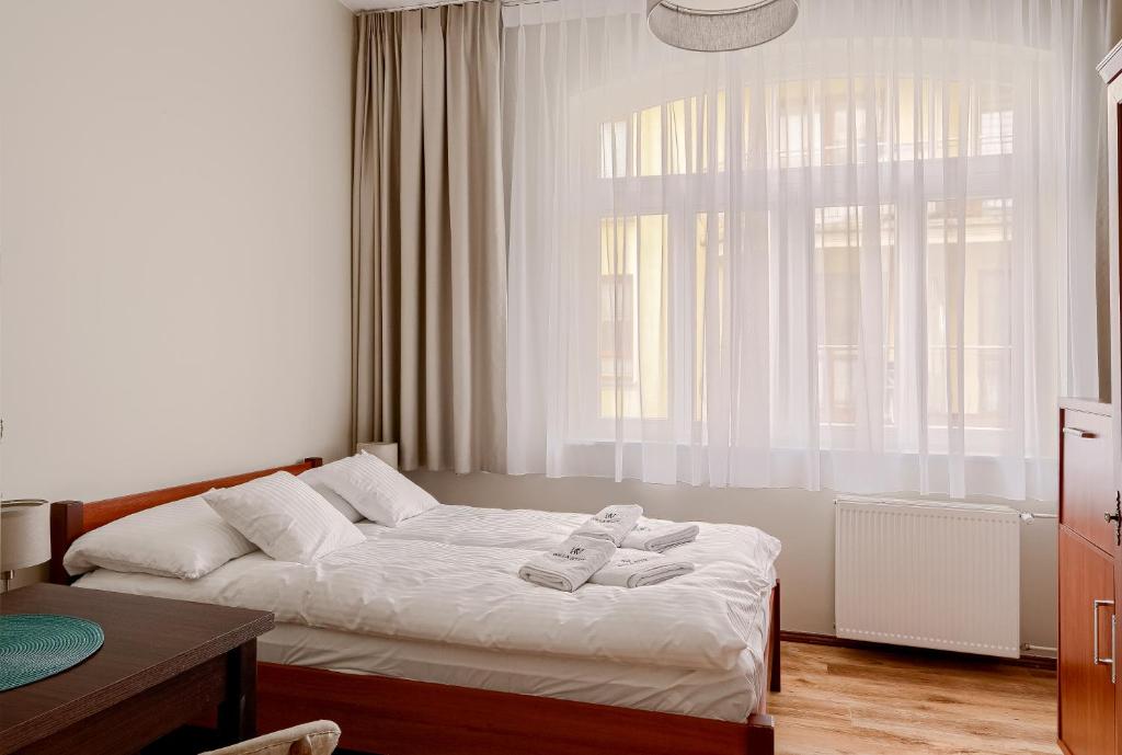 Postel nebo postele na pokoji v ubytování Willa Ster