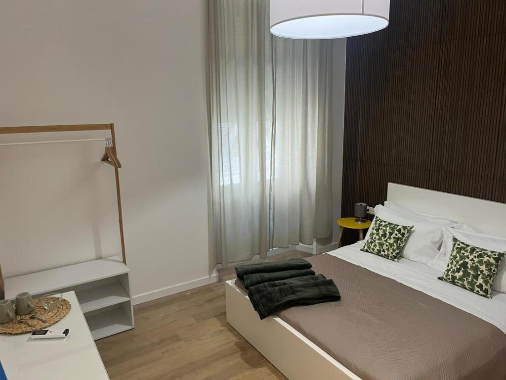 Postel nebo postele na pokoji v ubytování 20 Settembre Rooms