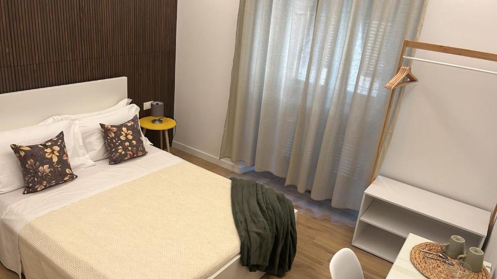 Postel nebo postele na pokoji v ubytování 20 Settembre Rooms