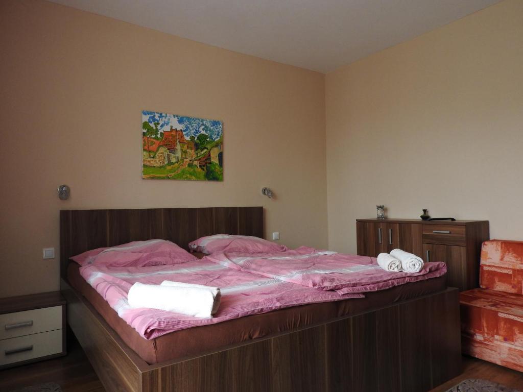Postel nebo postele na pokoji v ubytování Fridrich apartman