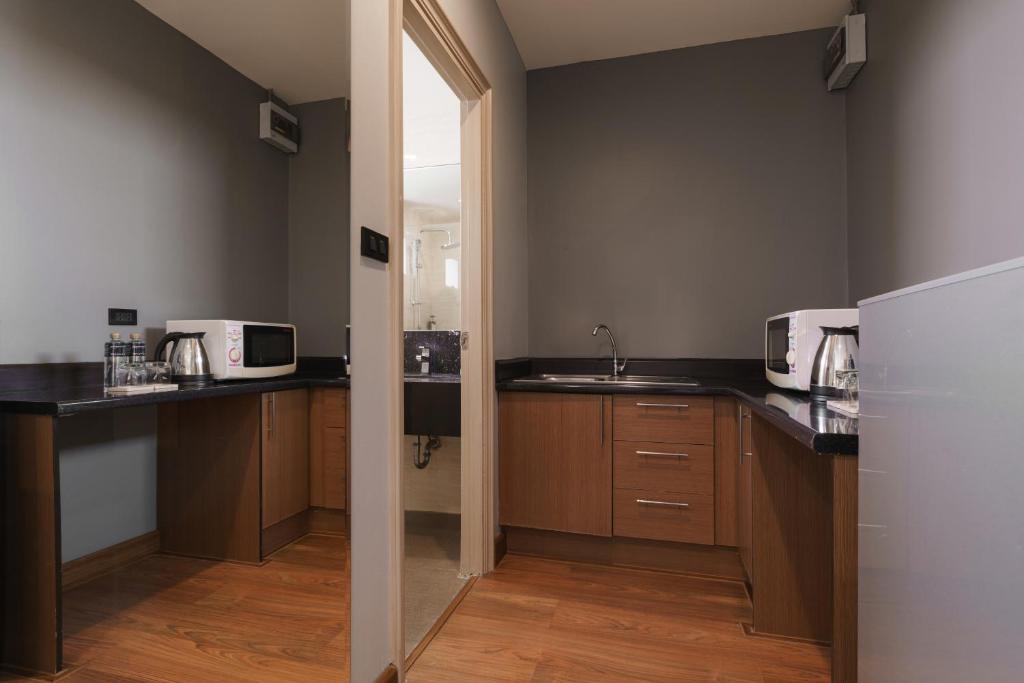 Kuchyň nebo kuchyňský kout v ubytování iCheck inn Residence soi 2