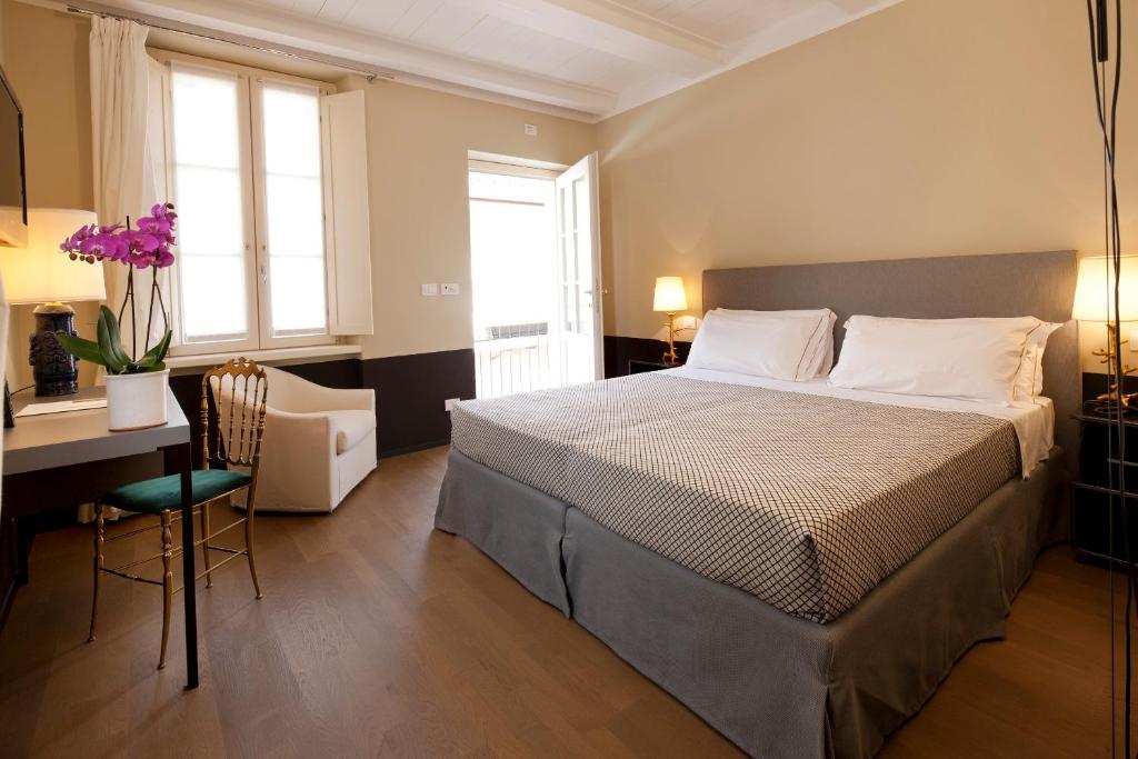 Postel nebo postele na pokoji v ubytování Maison Borella
