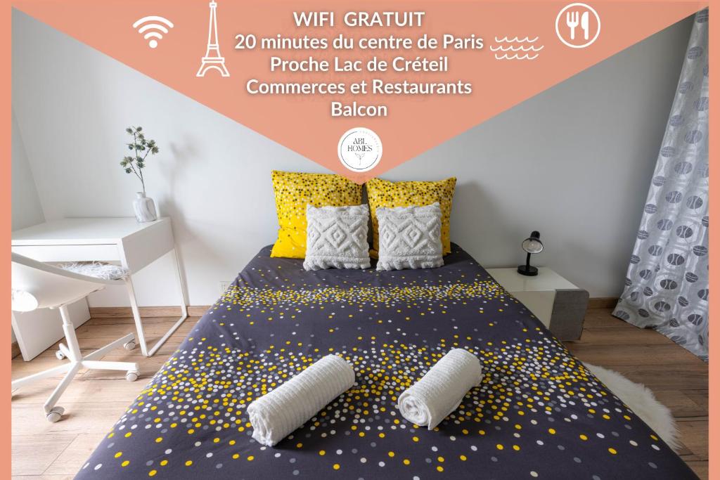 a bedroom with a bed with yellow polka dots at Le VAL HOME - 20min de PARIS et ORLY - Balcon - WIFI - Espace de travail in Valenton