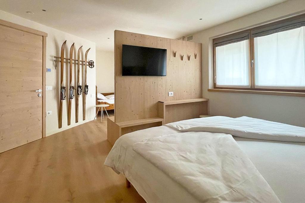 Postel nebo postele na pokoji v ubytování Alpine Rooms and Suites Livigno - Camana Noa -