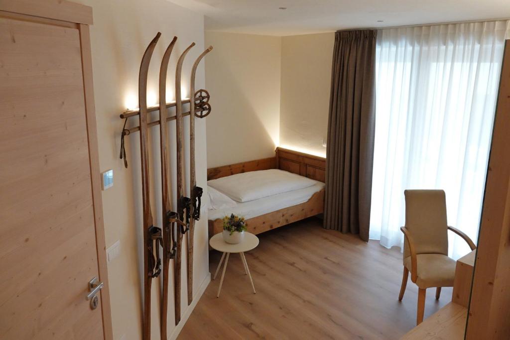 Postel nebo postele na pokoji v ubytování Alpine Rooms and Suites Livigno - Camana Noa -